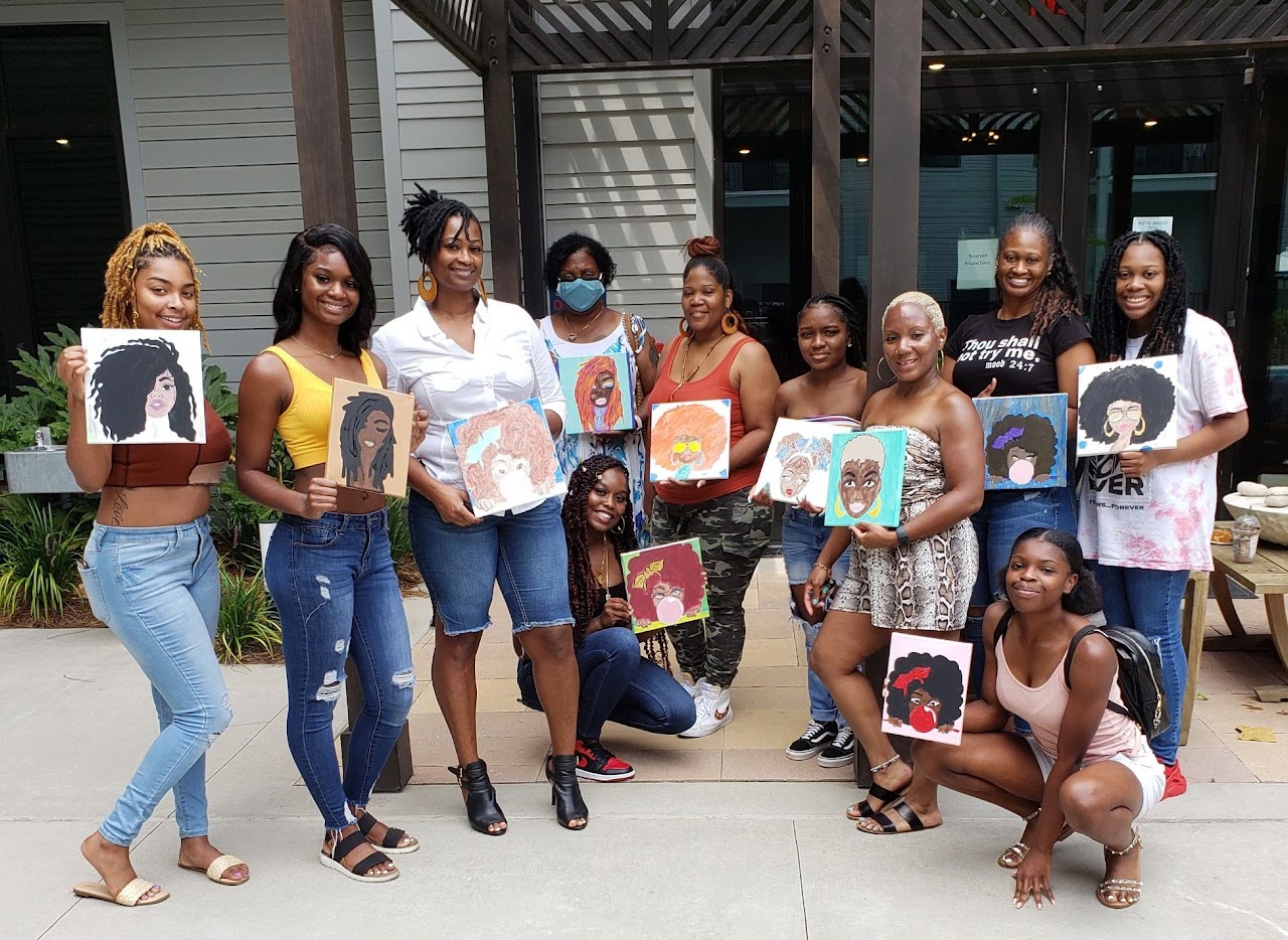 Women gathered together at an I Am She Officially event